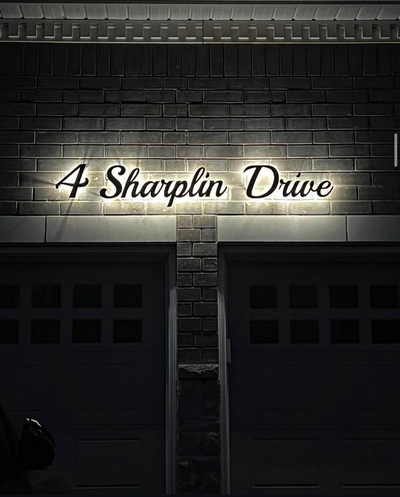 Illuminated address sign at night