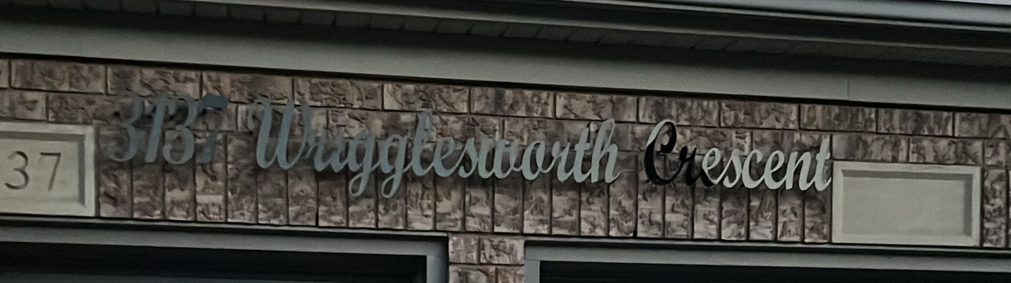 Modern home address sign during daytime
