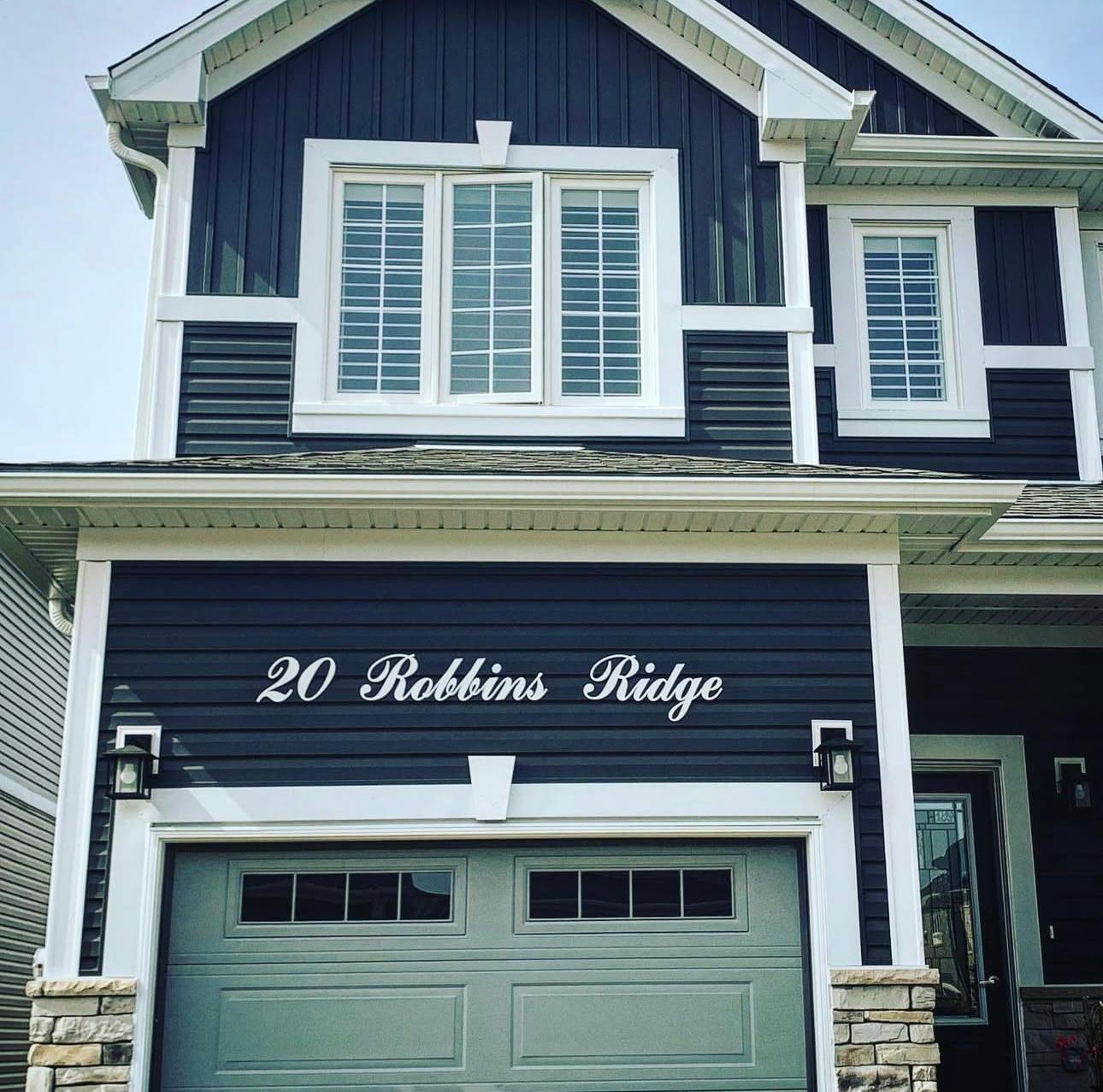 Modern home with warm LED address sign